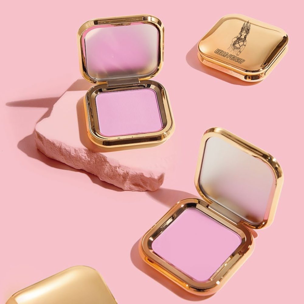 Open gold compact of Hello Peachy powder blush